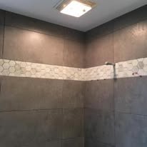 Bathroom shower tile with marble hexagon accent strip