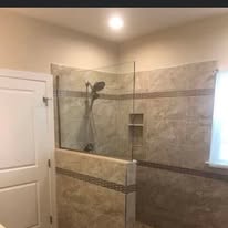 Bathroom shower remodel with frameless glass door and tile