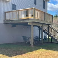 Elevated pressure-treated deck with stairs