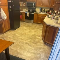 Kitchen with wood cabinets and tile floor