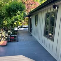 Composite deck with black metal railing