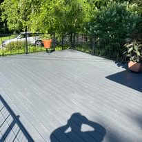 Gray composite deck with black metal railing