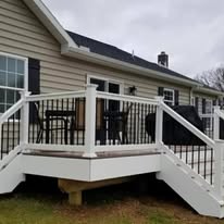 Composite deck with white and black metal railing