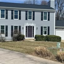 House exterior with new vinyl siding