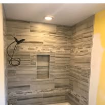 Walk-in shower with horizontal plank tile