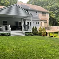 House exterior with covered porch and deck addition