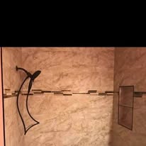 Bathroom shower with stone tile
