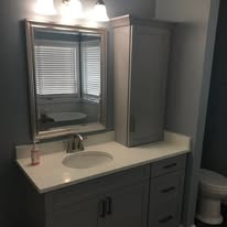 Bathroom vanity remodel with new mirror and fixtures