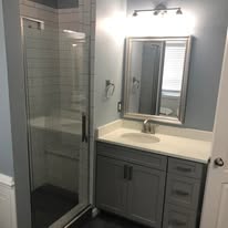 Bathroom remodel with glass shower and updated vanity