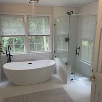 Luxury master bathroom remodel with freestanding tub and frameless glass shower